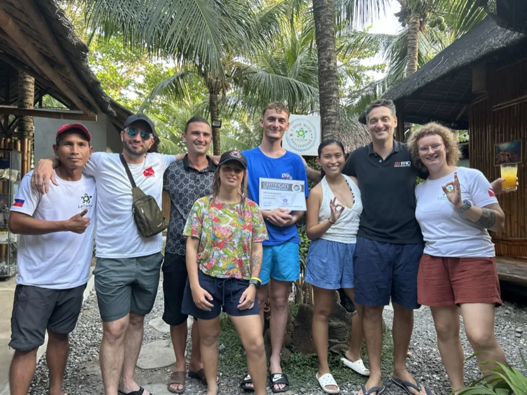 Antoine with instructors and other candidates during training